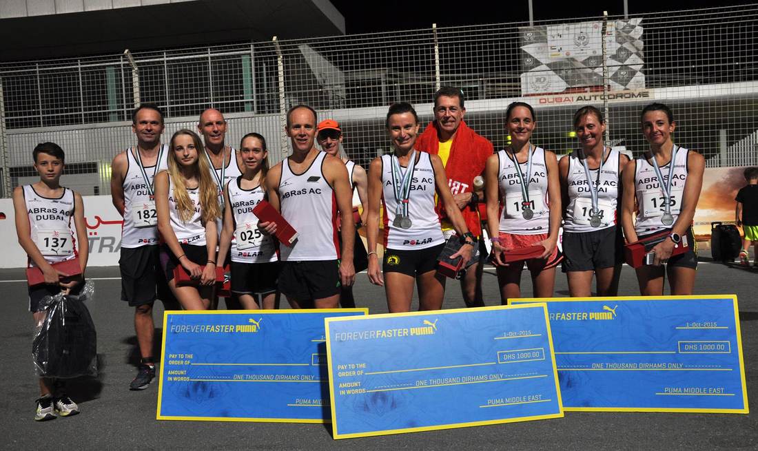 Team winners with a haul of prize cheques